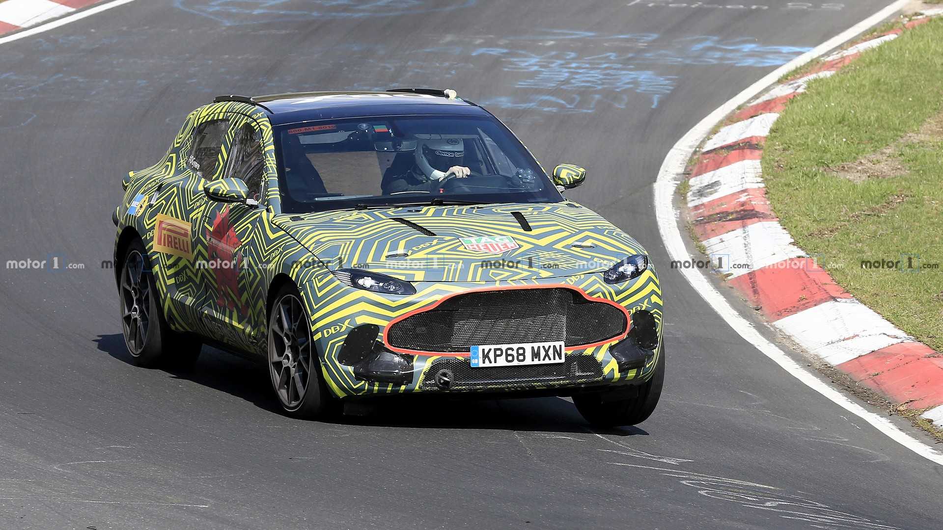 1558228845493119.jpg aston-martin-dbx-spy-photo (1).jpg